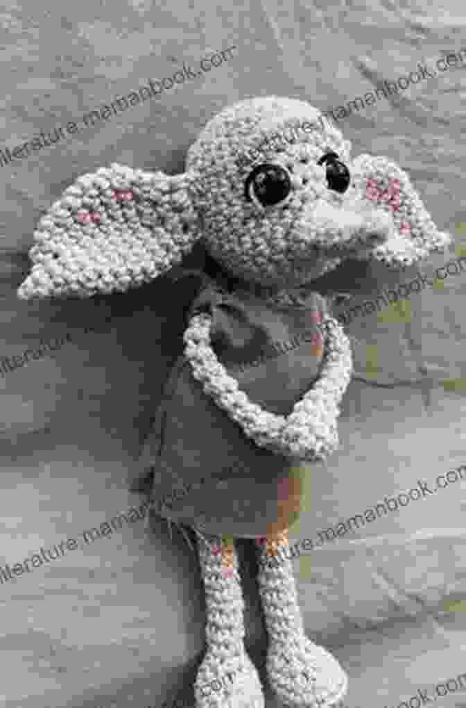A Charming Crochet Pattern Of Dobby The House Elf, Complete With Oversized Ears And A Tattered Pillowcase. Harry Potter: Crochet Wizardry: The Official Harry Potter Crochet Pattern